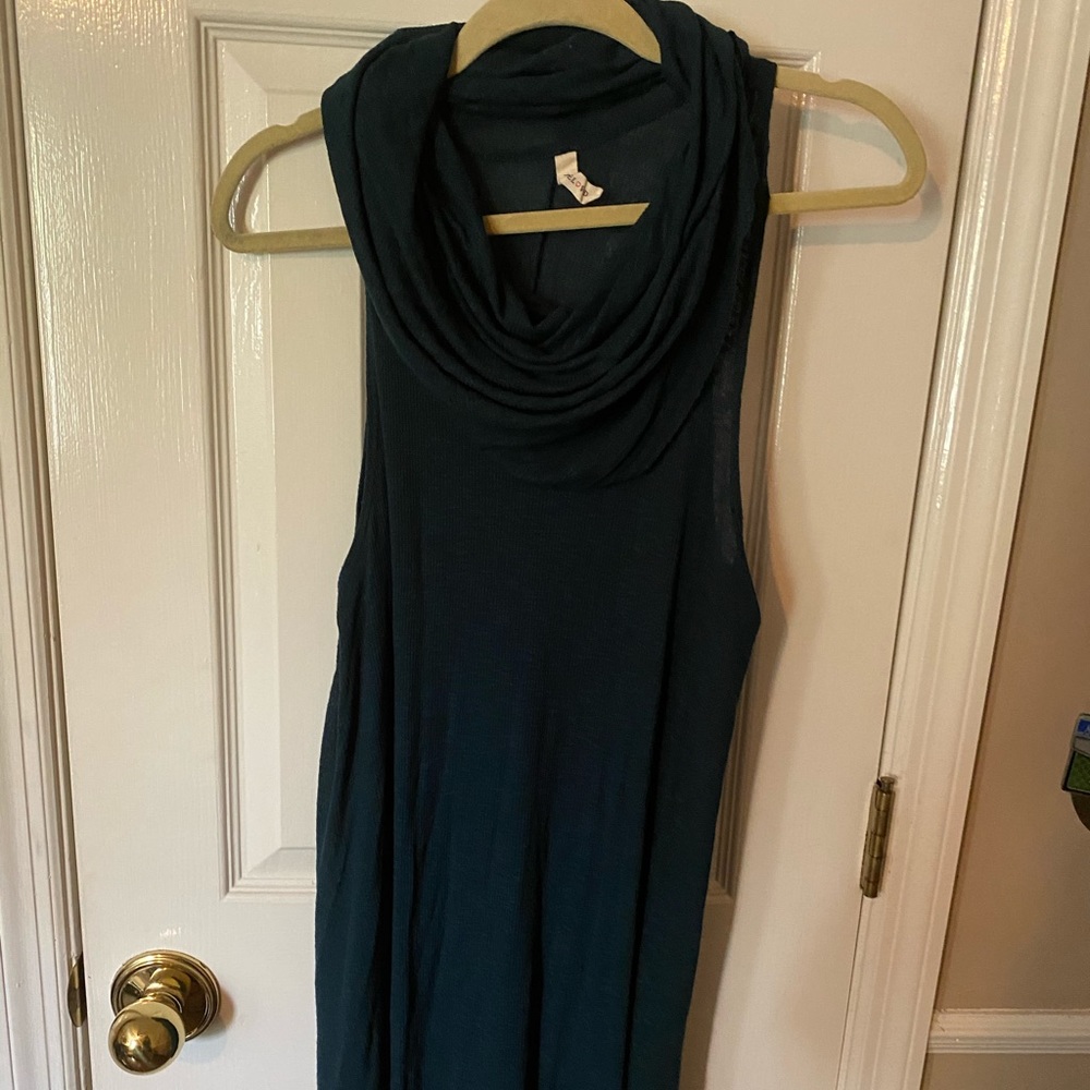 Sleeveless turquoise sweater